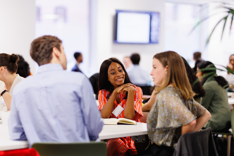 Image of 3 people talking at an event