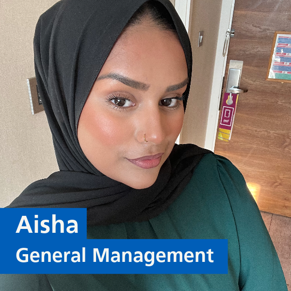Selfie of Aisha with text 'Aisha, General Management'
